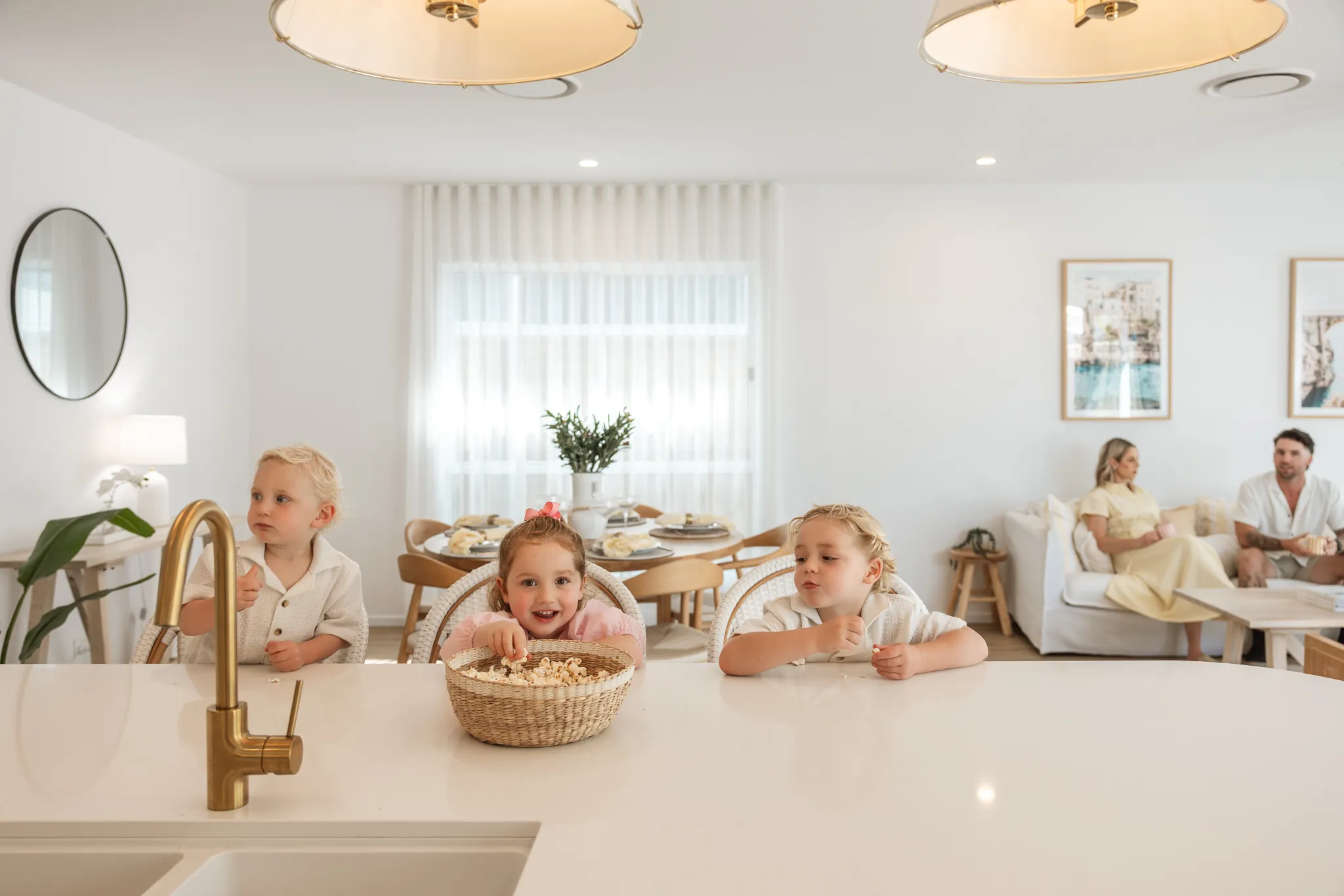 A family relaxing together in an open-plan Arcadia home